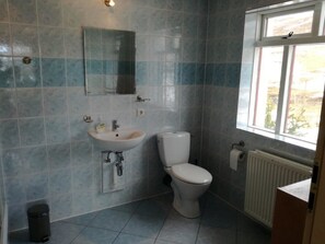 Shower, deep soaking tub, bathrobes, towels