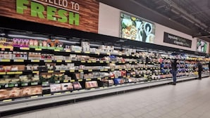 A grocery store aisle with a sign that reads "SAY HELLO TO FRESH." - WATER VIEW*4 Bedroom/Elevator/5 Star Condo* DISNEY Area (Kissimmee)