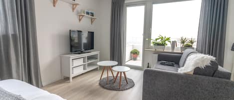 Exclusieve studio | Woonruimte | Een flatscreentelevisie