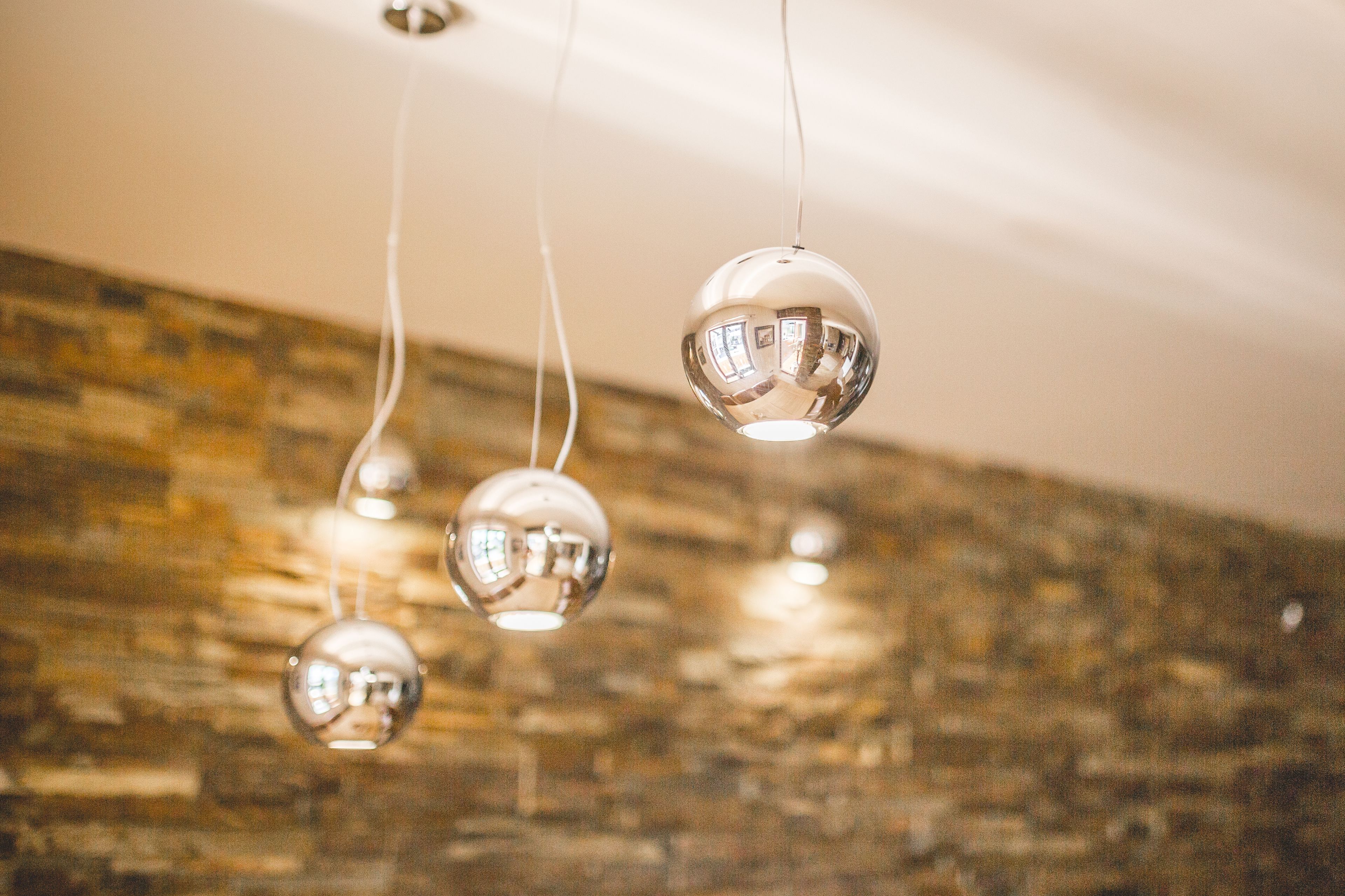 Three spherical pendant lights hanging from the ceiling.