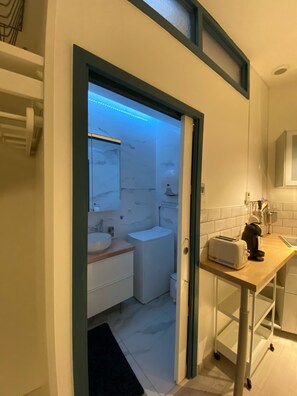 Shower, hair dryer, towels, soap