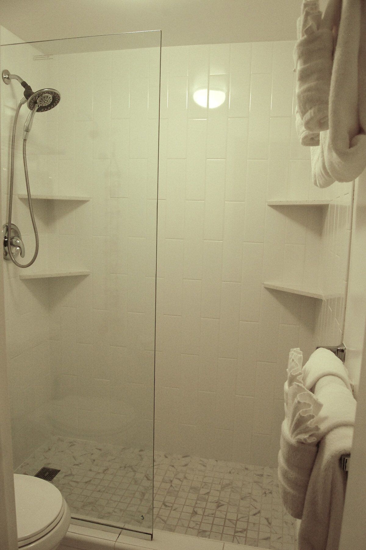 Combined shower/tub, hair dryer, towels, soap
