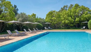 Seasonal outdoor pool, pool umbrellas, pool loungers