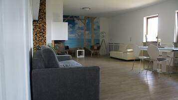 Romantic Apartment, 1 Bedroom, Garden Area (including 45 Euro cleaning fee) | Living room | Flat-screen TV, fireplace