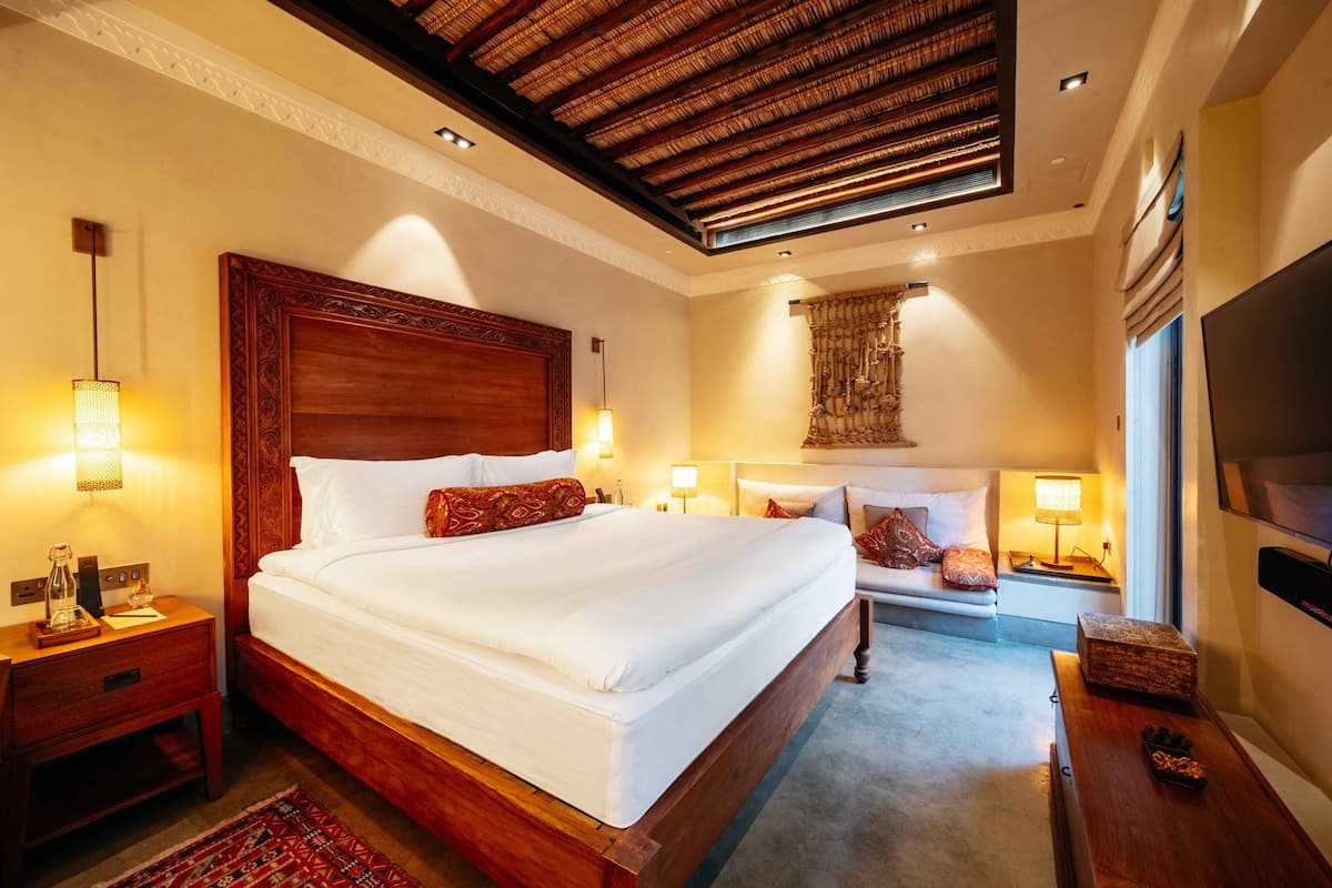 Deluxe Room, Patio (CHEDI) | Minibar, in-room safe, desk, blackout drapes