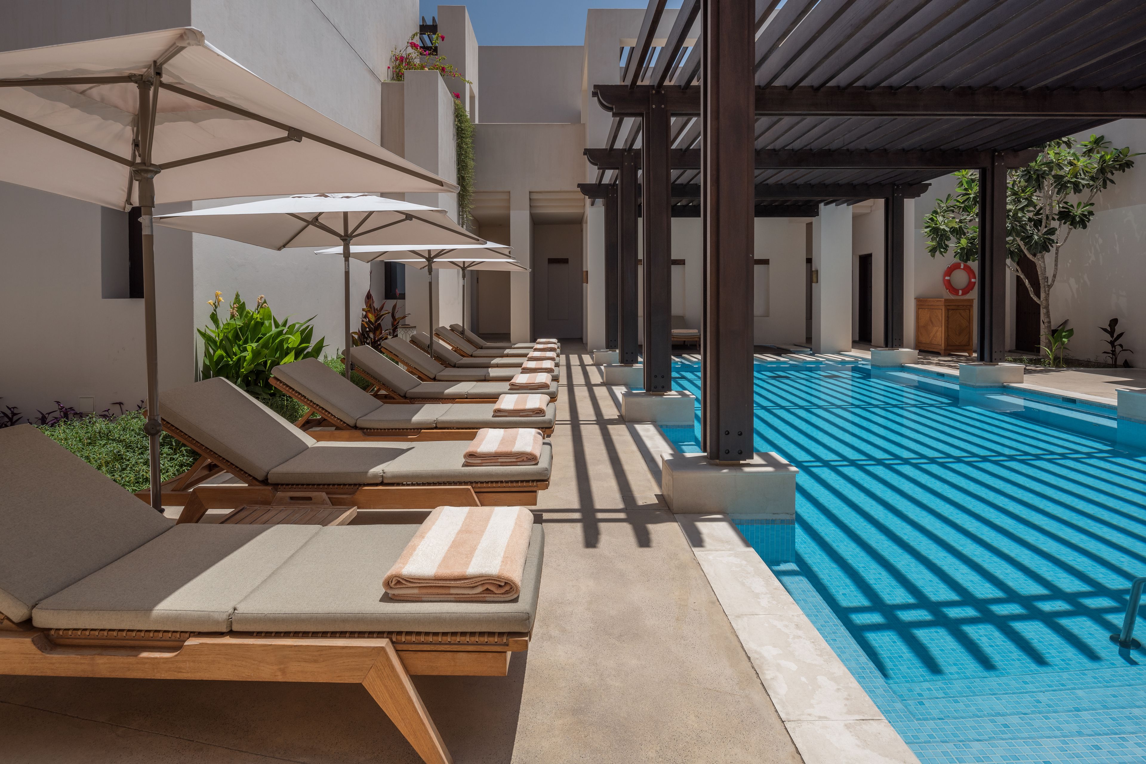 outdoor pool, open 7 am to 7 pm, pool umbrellas, pool loungers