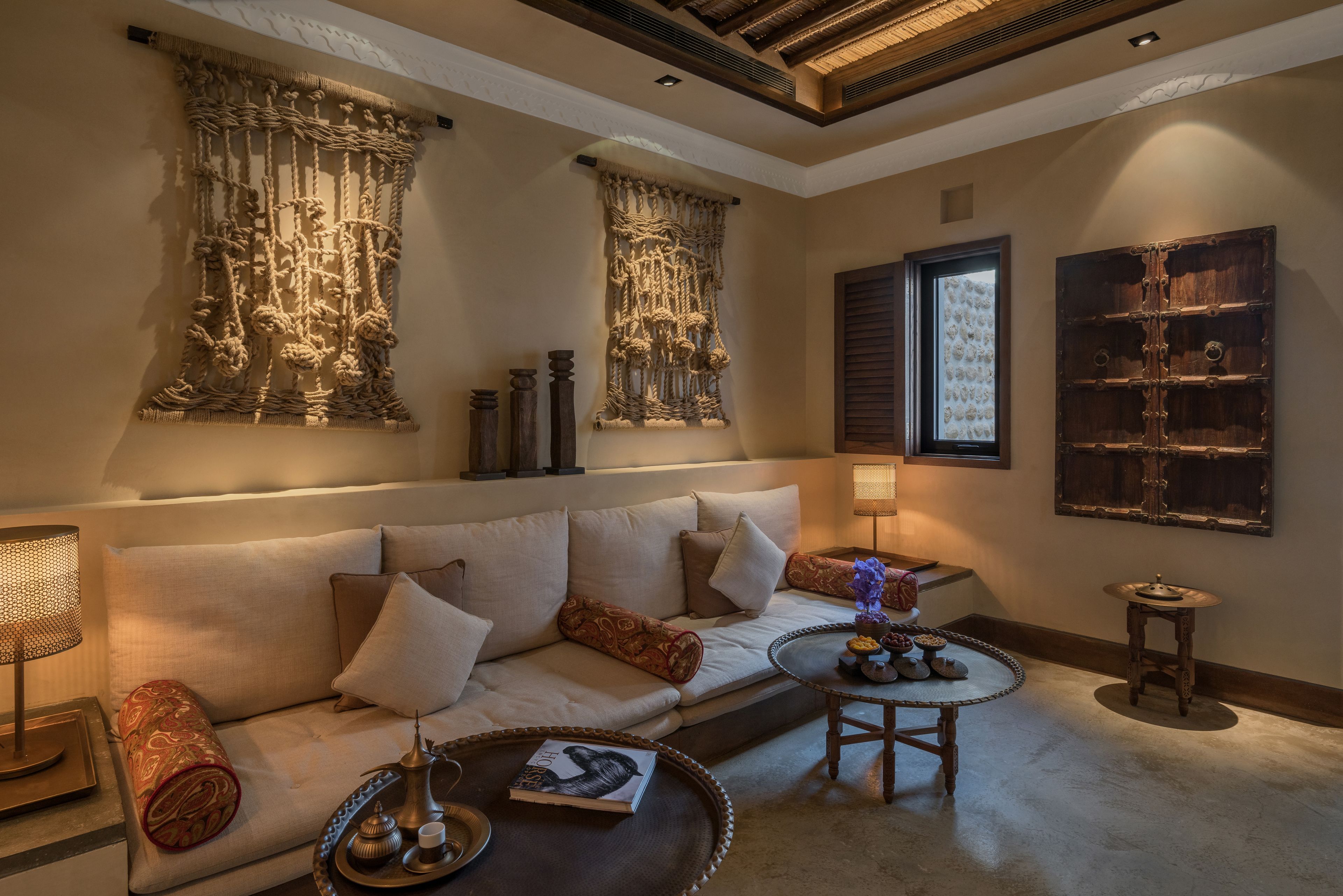 A cozy living room with a sofa, a coffee table, and decorative items.
