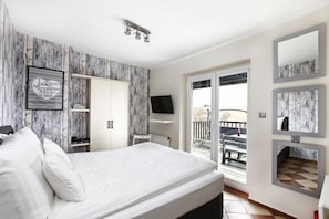 Habitació doble Deluxe | Roba de llit d'alta qualitat i decoració individual