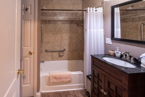 Combined shower/tub, hair dryer, towels, soap