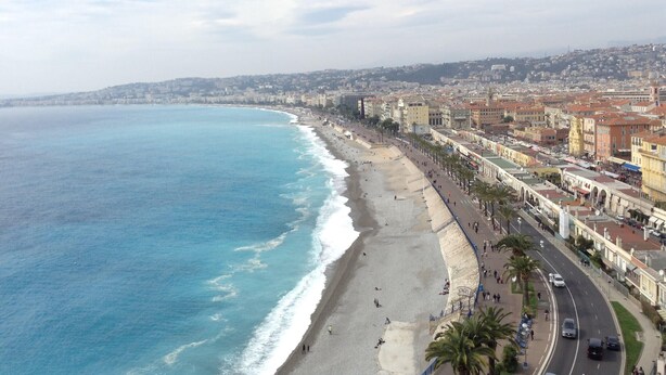 A coastal cityscape with a beach, promenade, and buildings along the shore. - A beautiful apartment tastefully decorated ... (Nice)