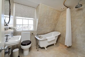 Bathtub, hair dryer, towels, soap