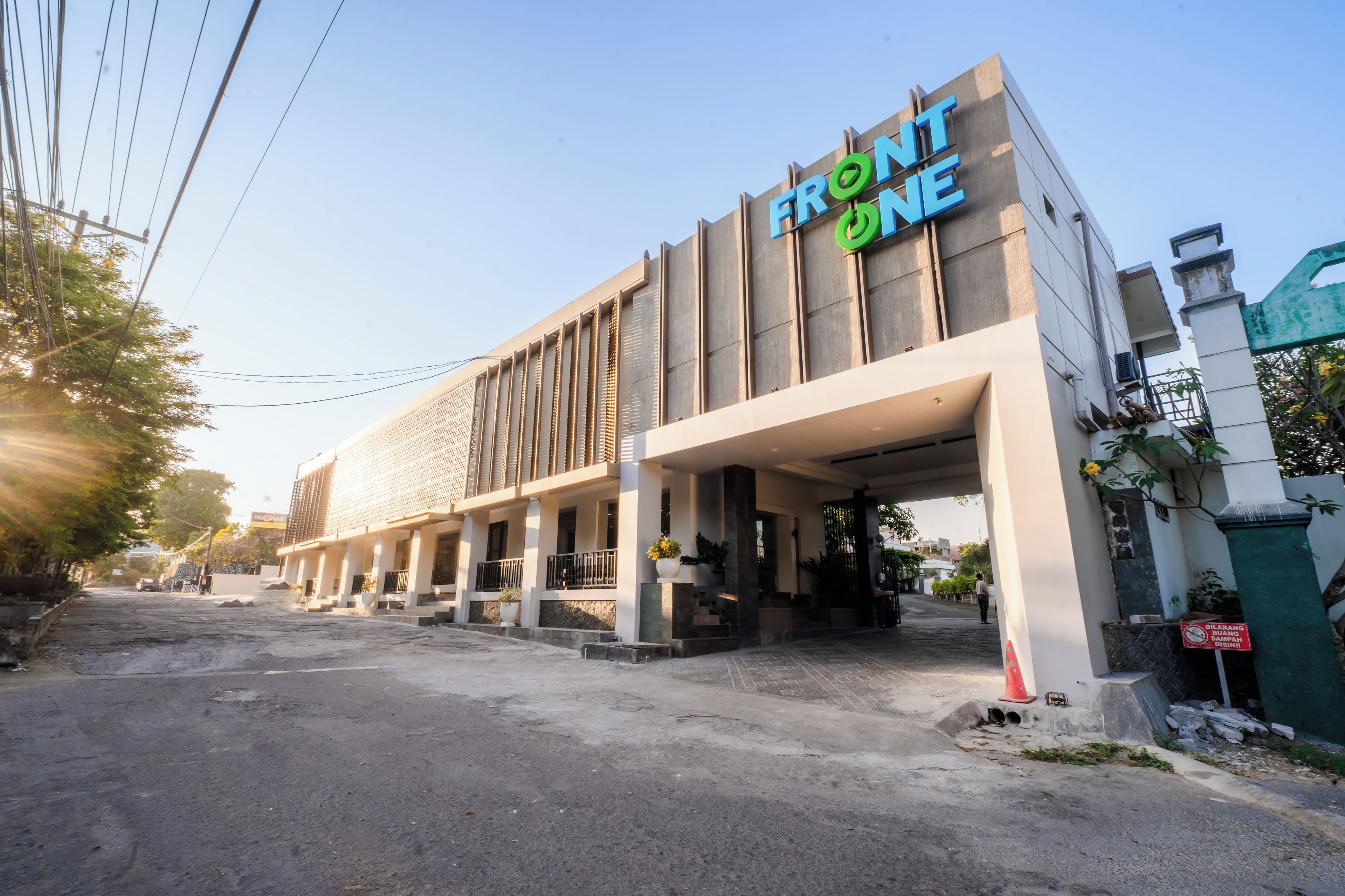 A building with a sign that reads 'FRONT ONE'.