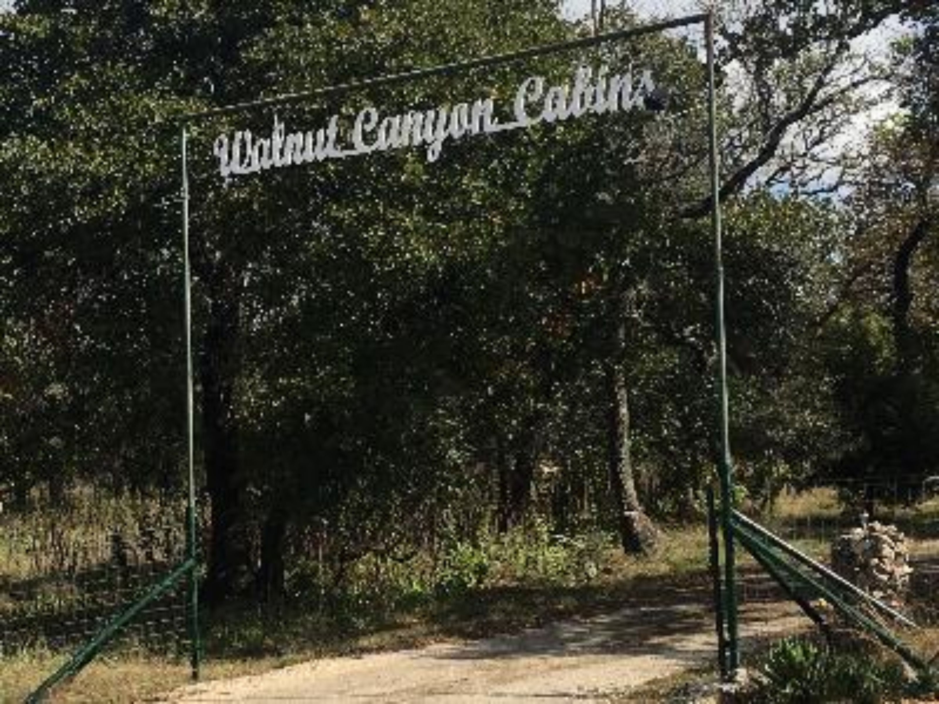 A sign for Walnut Canyon Cabins.