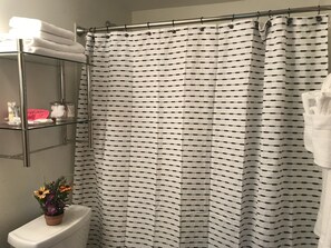Combined shower/tub, hair dryer, towels, soap