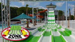 A water park with a green and white water slide, a red water slide, and a small pavilion. - LAKEFRONT, 5 BDRM, Ocean View! Quiet. Fish off deck. Just reduced Aug wks! (Myrtle Beach)