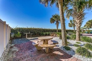 Outdoor dining - BEAUTIFUL BEACHFRONT Condo- Quiet- Pool, Hot Tub, Lazy River, Easy Beach Access (North Myrtle Beach)
