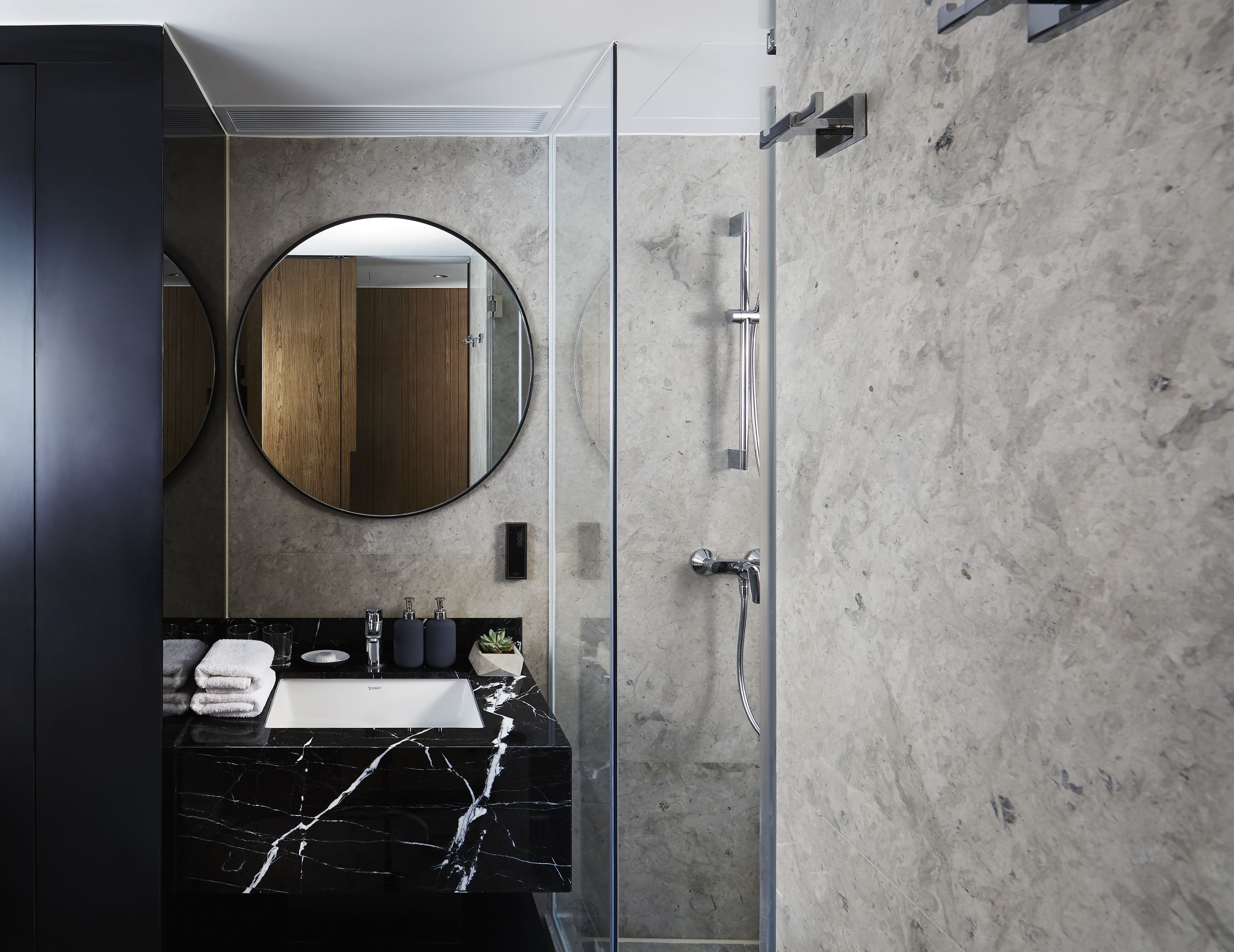 deluxe queen room | bathroom | shower, hair dryer, slippers, towels