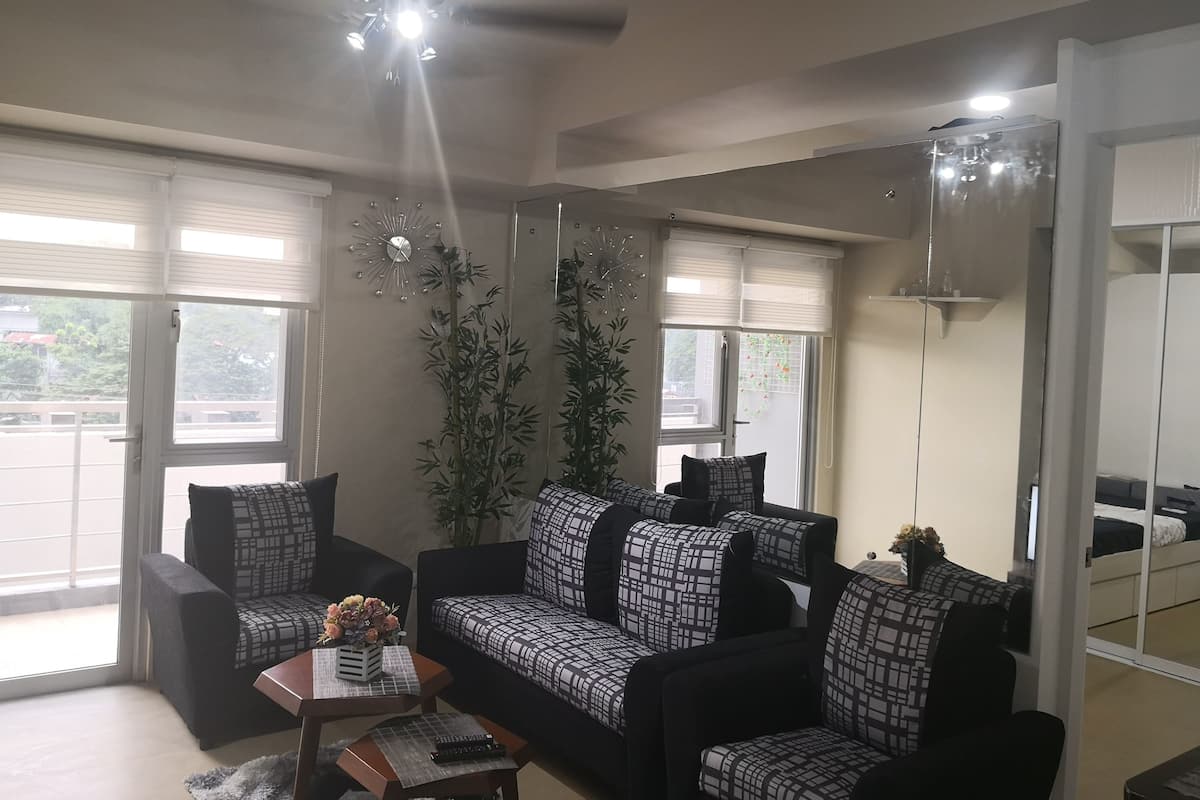 Centrio Tower, 1 Bedroom with Balcony | Living area | Flat-screen TV