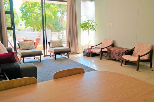 Apartment (1 Bedroom) | Living room | Flat-screen TV