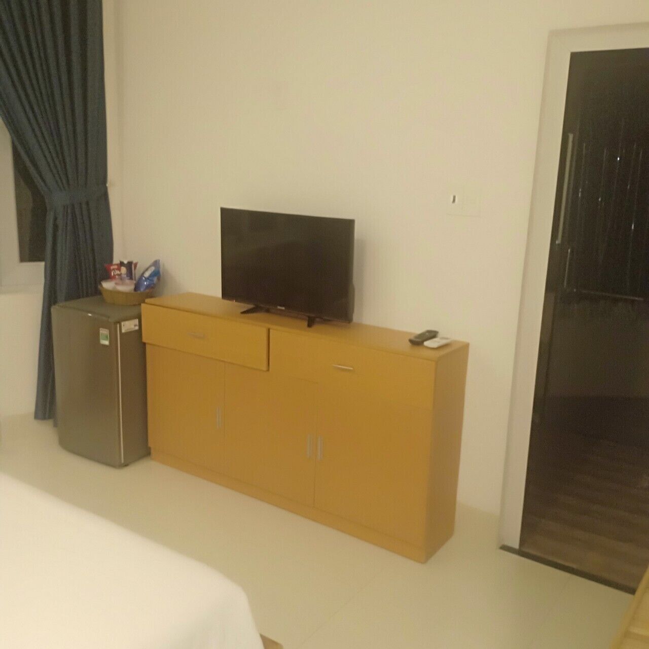 minibar, desk, blackout curtains, iron/ironing board