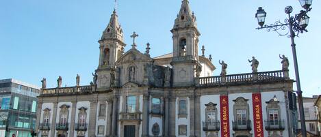 A historic building with two prominent towers and a central entrance.