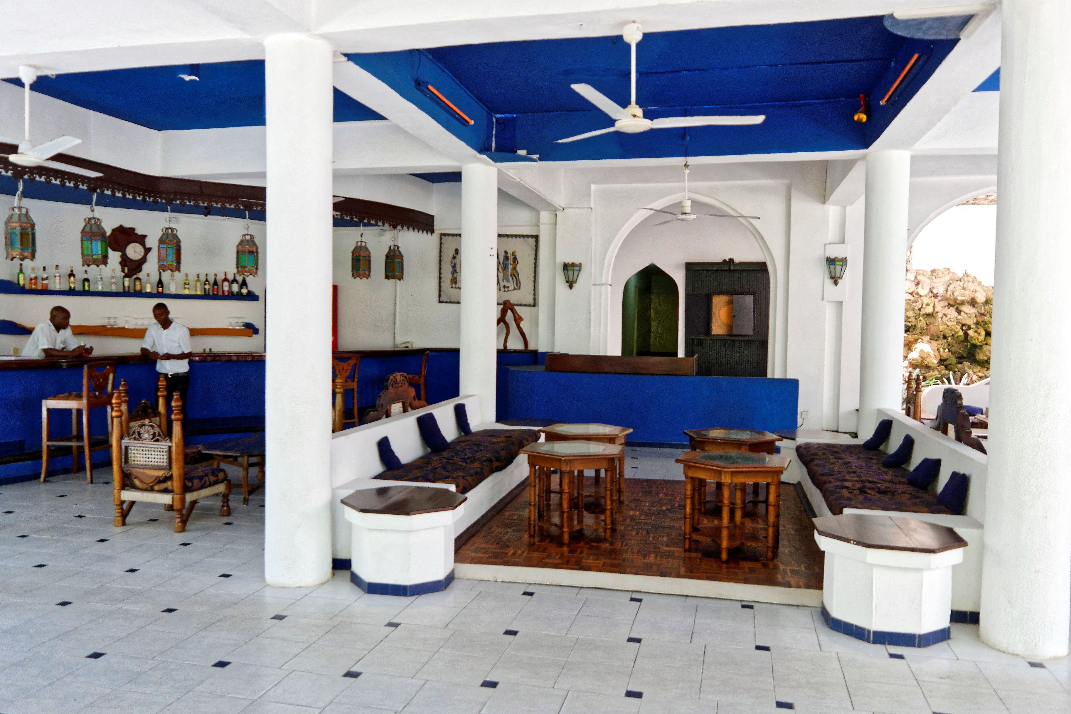 A bar area with seating and a counter.