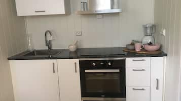 Apartment, 1 Bedroom | Private kitchen | Fridge, oven, stovetop, coffee/tea maker