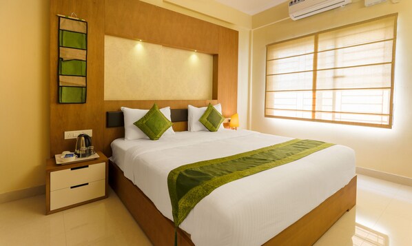 Habitación Deluxe | Tabla de planchar con plancha, camas extra y wifi gratis