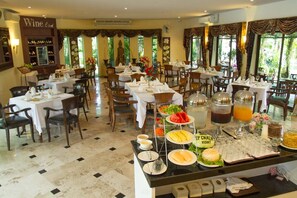 Breakfast, lunch, dinner served; international cuisine, pool views 