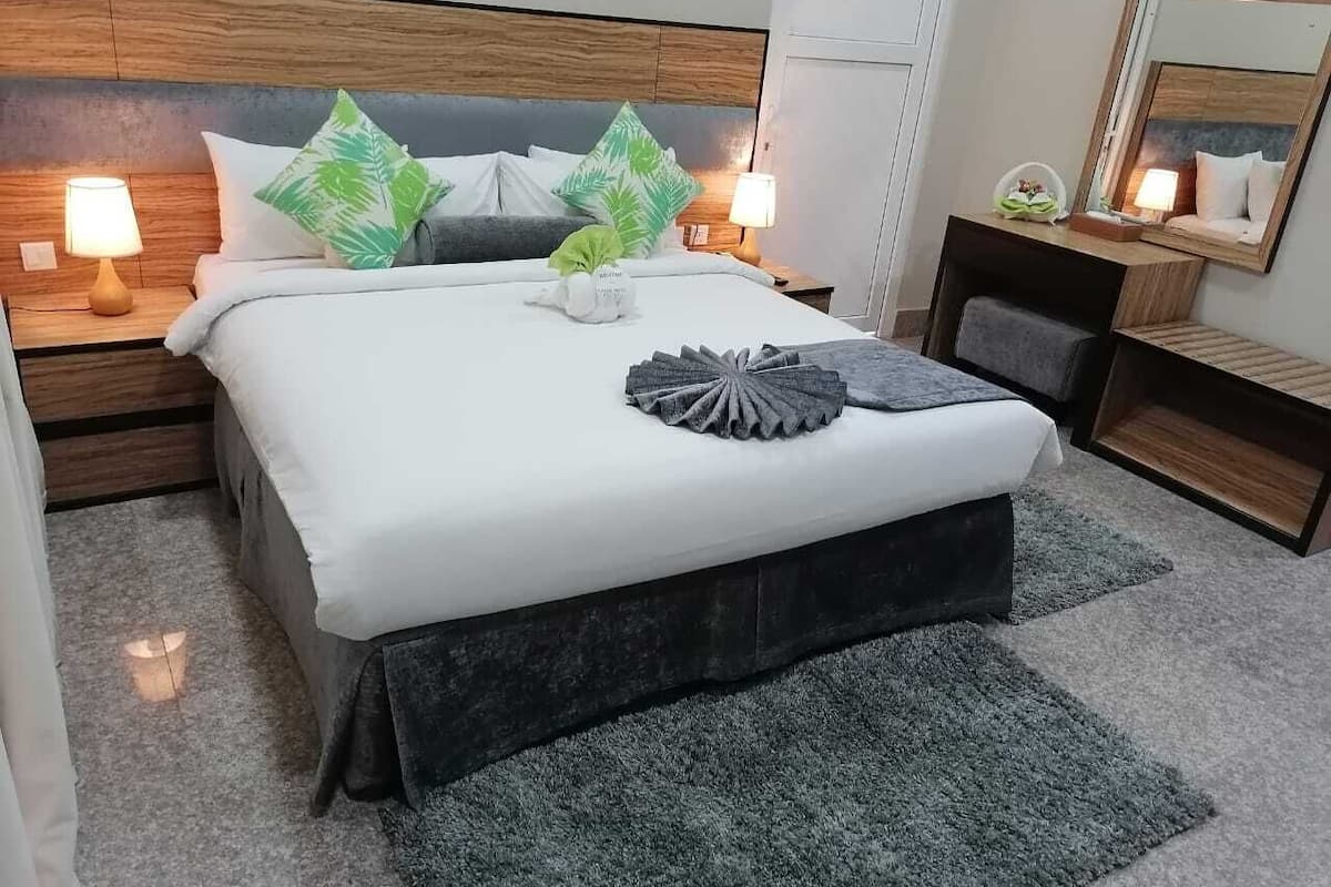 Family Deluxe Room (City & Sunrise View) | Minibar, in-room safe, desk, blackout drapes