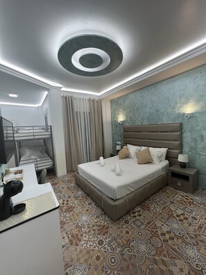 Deluxe Quadruple Room, Patio | Minibar, in-room safe, desk, laptop workspace - Hotel Galeón Boutique (Calpe)
