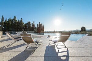 Seasonal outdoor pool, an infinity pool, sun loungers