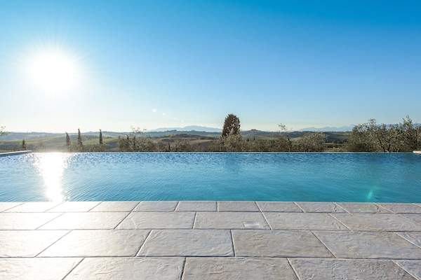 Seasonal outdoor pool, an infinity pool, pool loungers