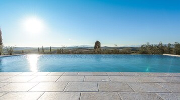 Seasonal outdoor pool, an infinity pool, sun loungers