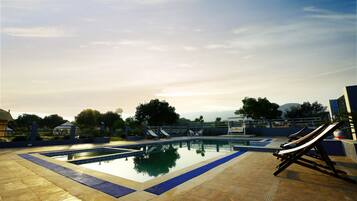 Outdoor pool, open 8:00 AM to 8:00 PM, sun loungers