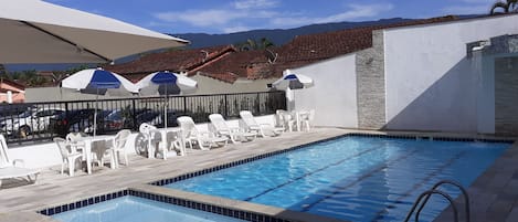 Outdoor pool, open 9:00 AM to 8:30 PM, pool umbrellas, pool loungers