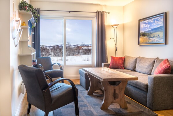 Apartment, 2 Bedrooms | Living room | Flat-screen TV