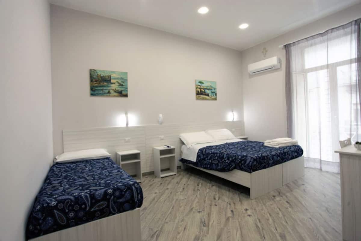 Deluxe Quadruple Room | Premium bedding, minibar, in-room safe, desk