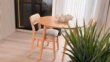 Panoramic Room, Sea View | Living area | 20-inch flat-screen TV with cable channels, TV