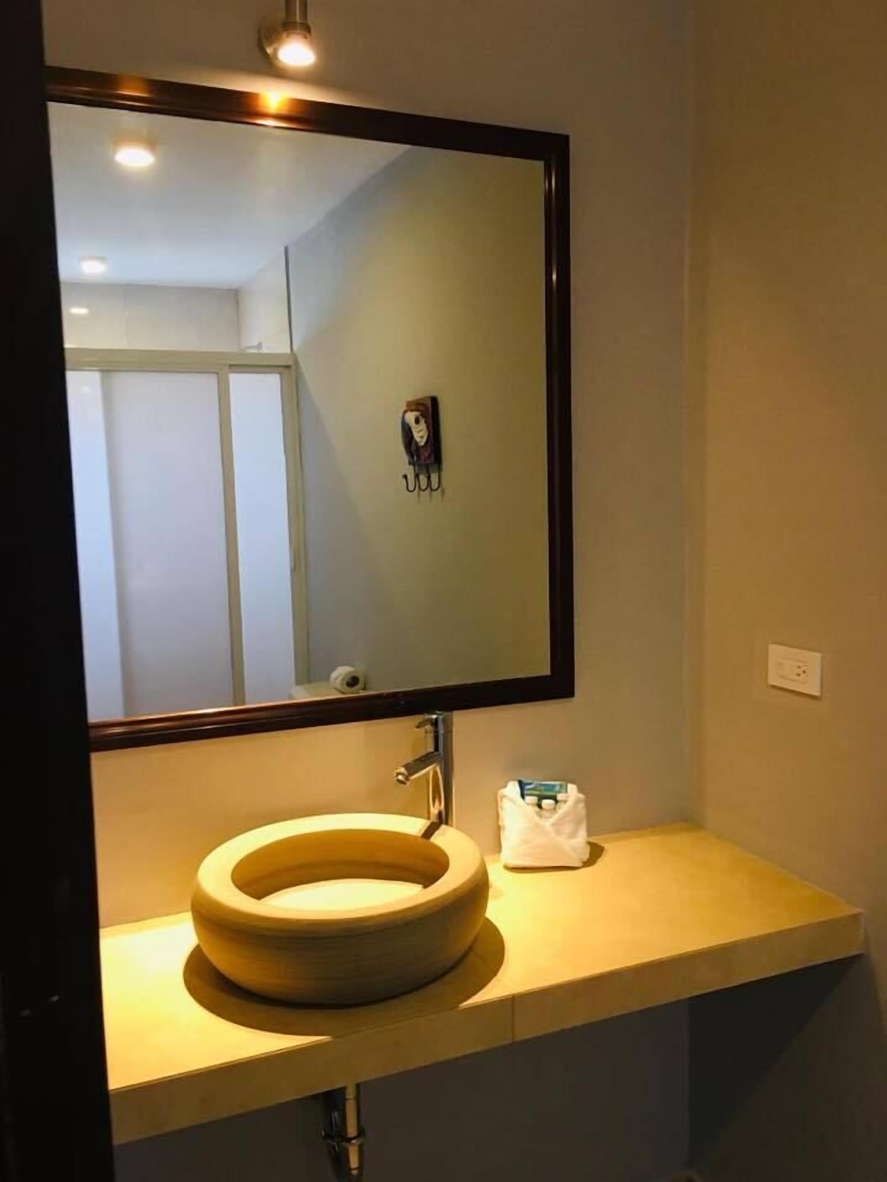 basic suite | bathroom | shower, free toiletries, towels