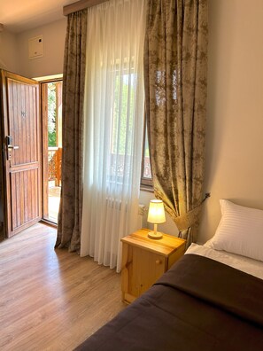 Economy Triple Room | Select Comfort beds, in-room safe, individually decorated