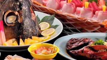 A variety of seafood dishes including grilled fish, shrimp, and sashimi.