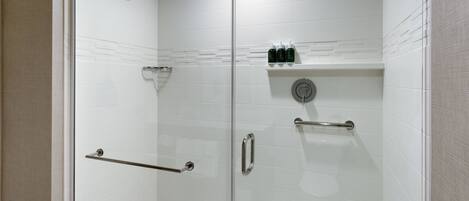 A modern shower area with a glass door, a handheld showerhead, a handheld showerhead, a glass-enclosed shower, a glass-enclosed shower, a glass-enclosed shower, a glass-enclosed shower, a glass-enclosed shower, a glass-enclosed shower, a glass-enclosed shower, a glass-enclosed shower, a glass-enclosed shower, a glass-enclosed shower, a glass-enclosed shower, a glass-enclosed shower, a glass-enclosed shower, a glass-enclosed shower, a glass-enclosed shower, a glass-enclosed shower, a glass-enclosed shower, a glass-enclosed shower, a glass-enclosed shower, a glass-enclosed shower, a glass-enclosed shower, a glass-enclosed shower, a glass-enclosed shower, a glass-enclosed shower, a glass-enclosed shower, a glass-enclosed shower, a glass-enclosed shower, a glass-enclosed shower, a glass-enclosed shower, a glass-enclosed