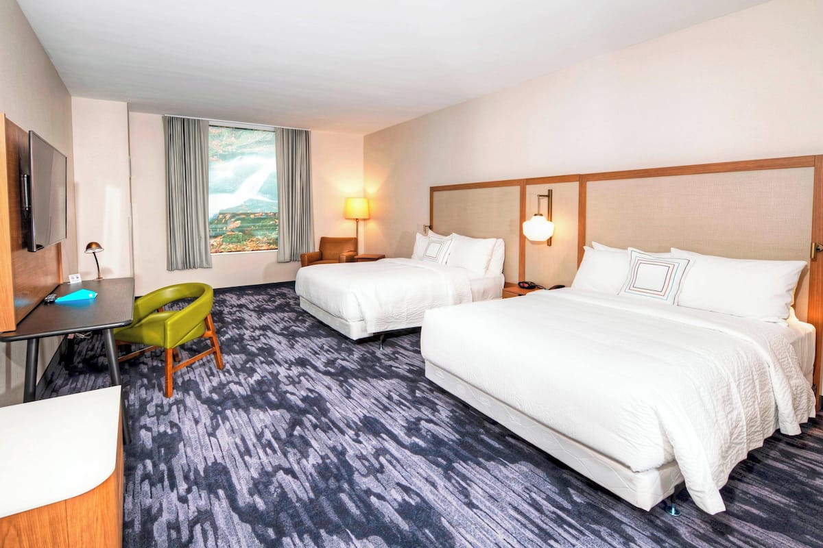 room, 2 queen beds | desk, iron/ironing board, free cots/infant beds, rollaway beds