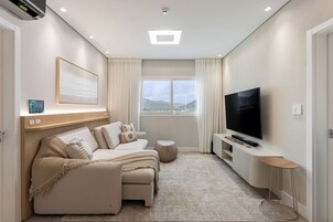 Deluxe Apartment | Living room | 43-inch Smart TV with cable channels, TV, Netflix