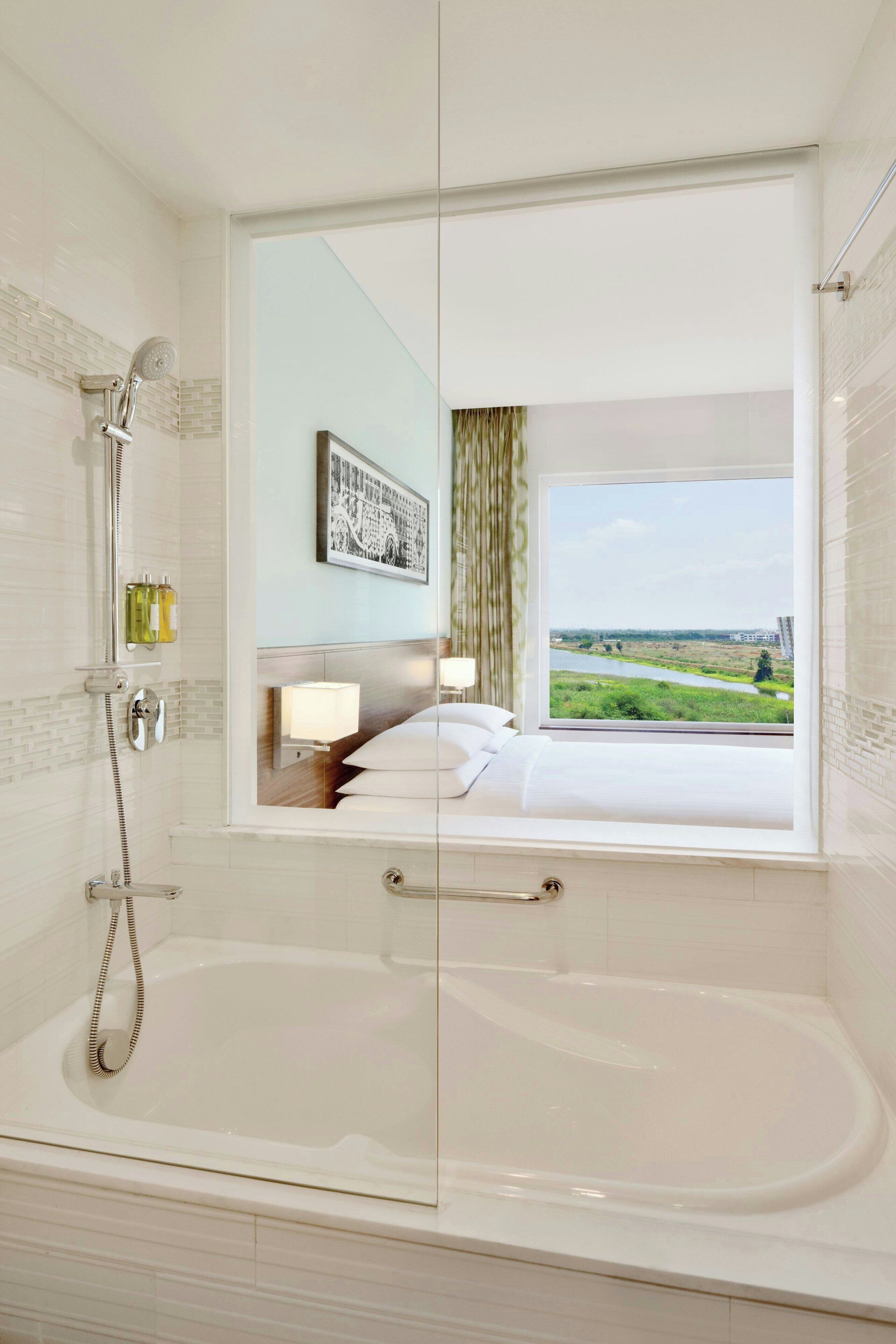 premier room, 1 king bed, non smoking | bathroom | shower, rainfall showerhead, designer toiletries, hair dryer