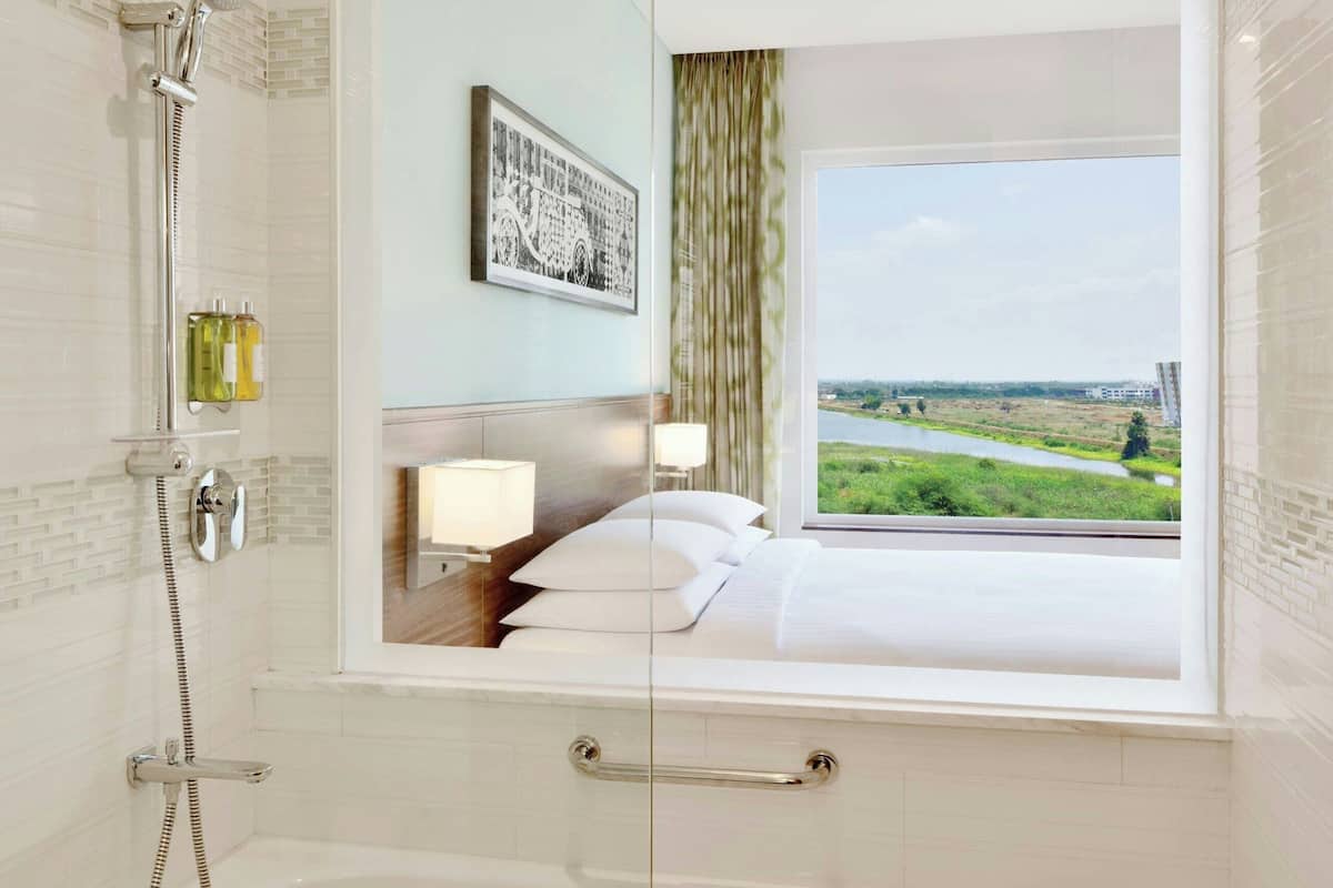 premier room, 1 king bed, non smoking | bathroom | shower, rainfall showerhead, designer toiletries, hair dryer