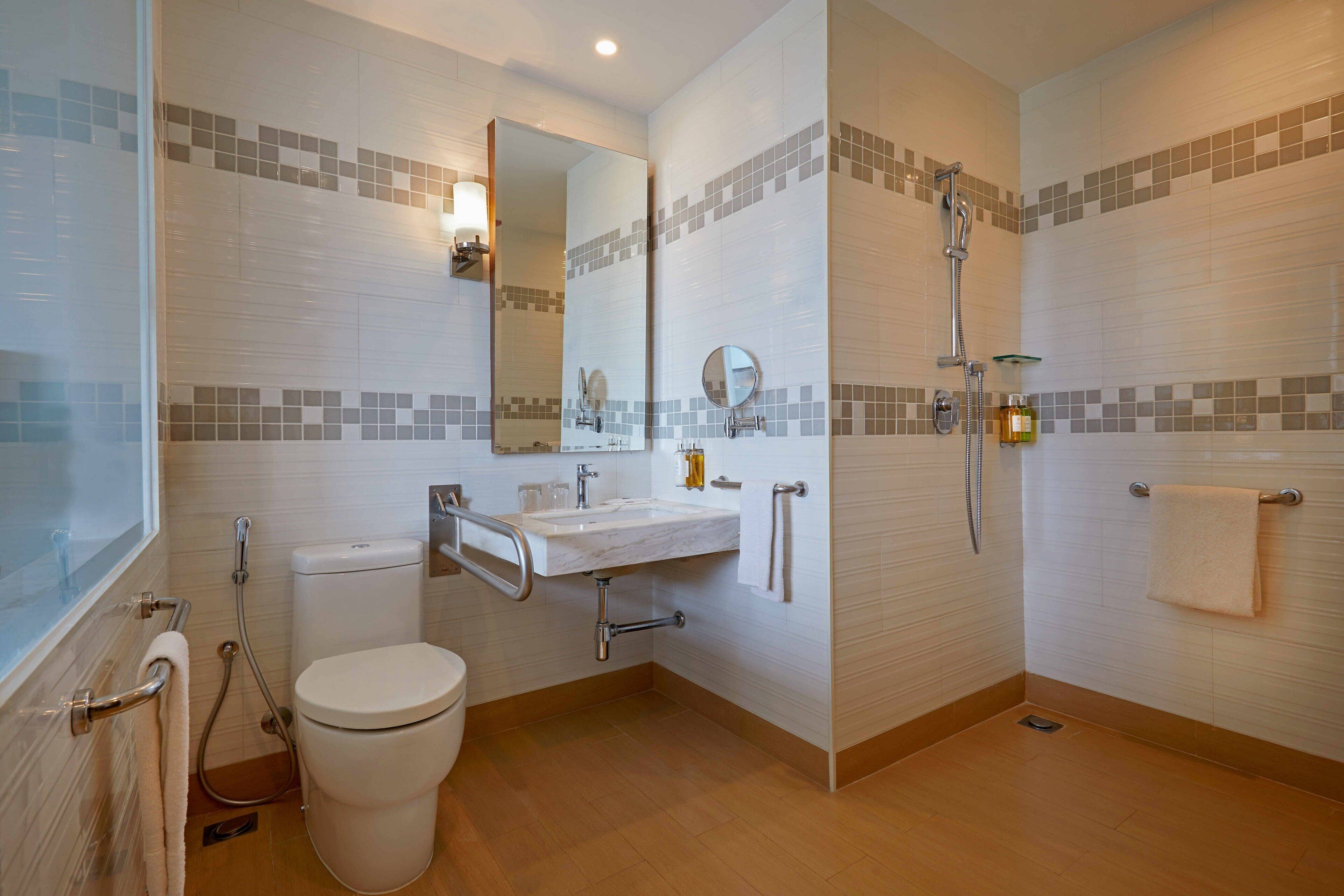 premier room, 1 king bed, pool view | bathroom | shower, rainfall showerhead, designer toiletries, hair dryer