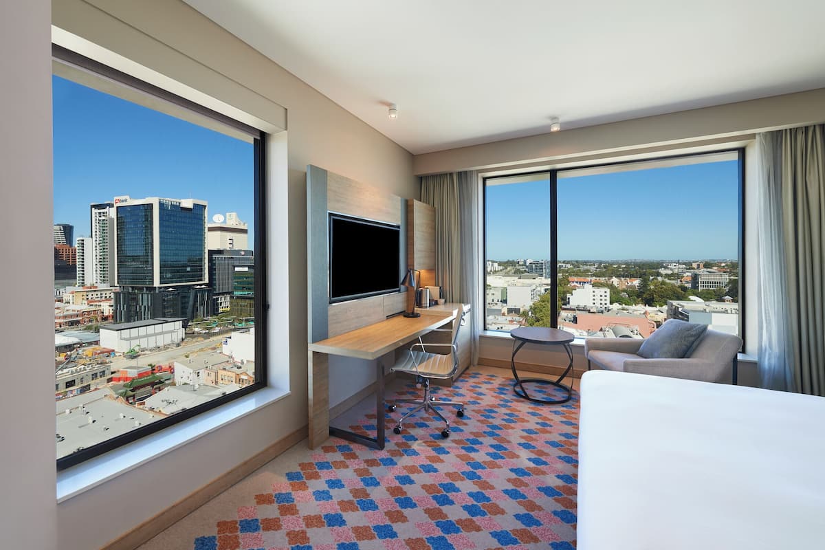 room, 1 king bed, corner | in-room safe, desk, blackout curtains, iron/ironing board