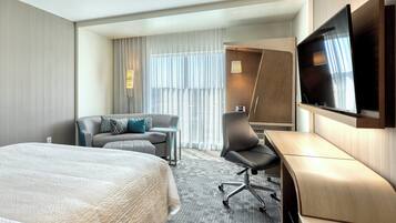 Premium bedding, pillow-top beds, desk, laptop workspace